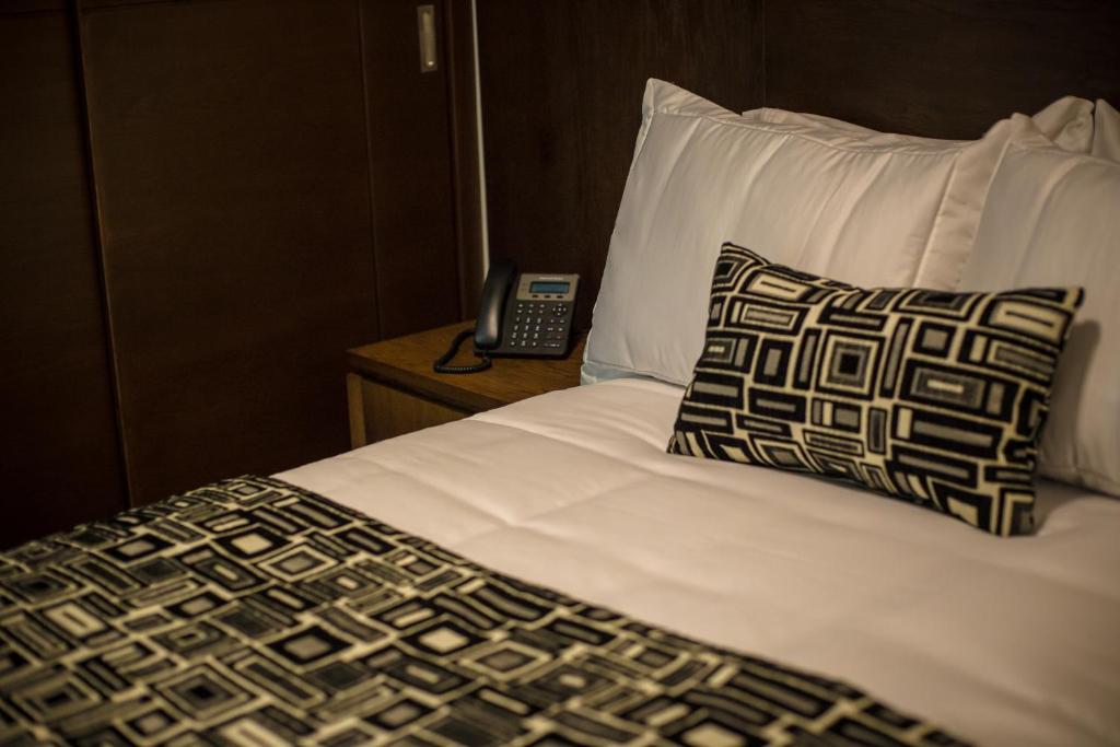 Postel nebo postele na pokoji v ubytování Hotel Corral Grande