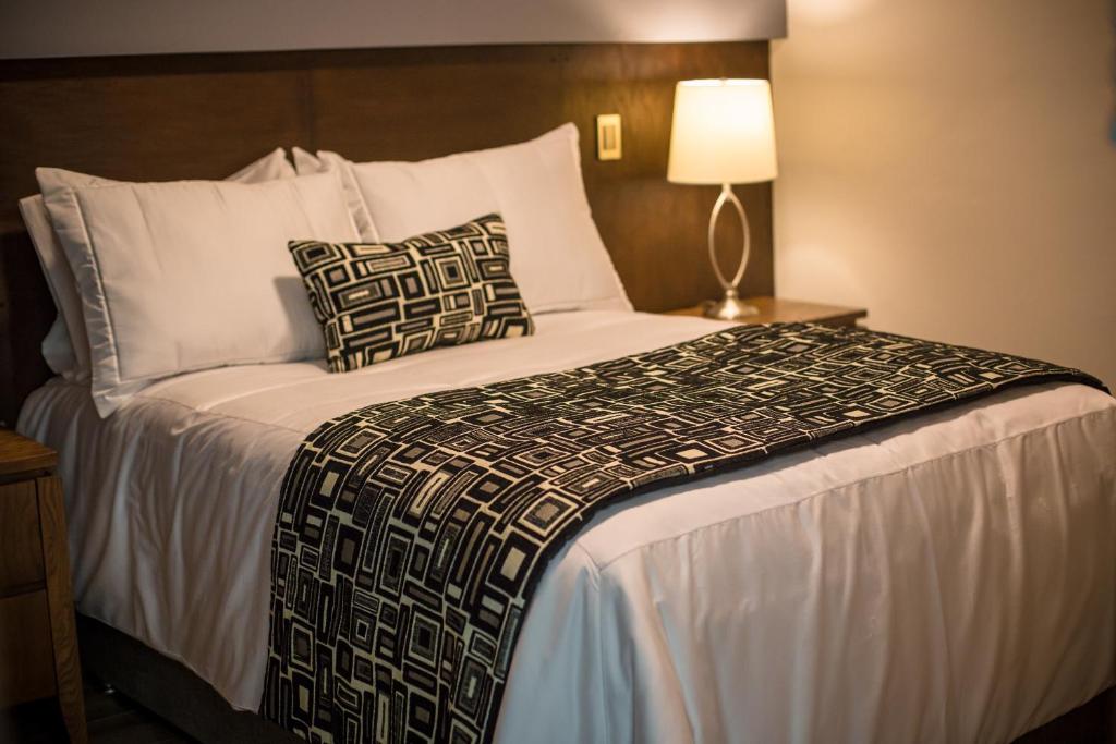 Postel nebo postele na pokoji v ubytování Hotel Corral Grande