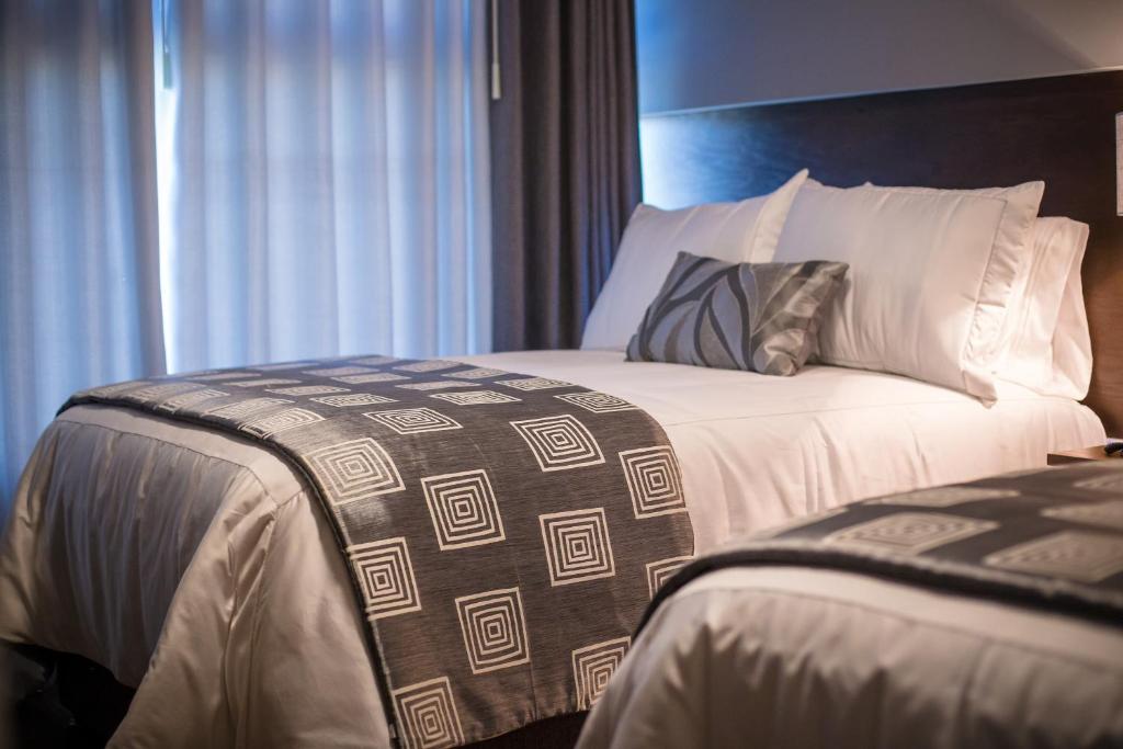 Postel nebo postele na pokoji v ubytování Hotel Corral Grande