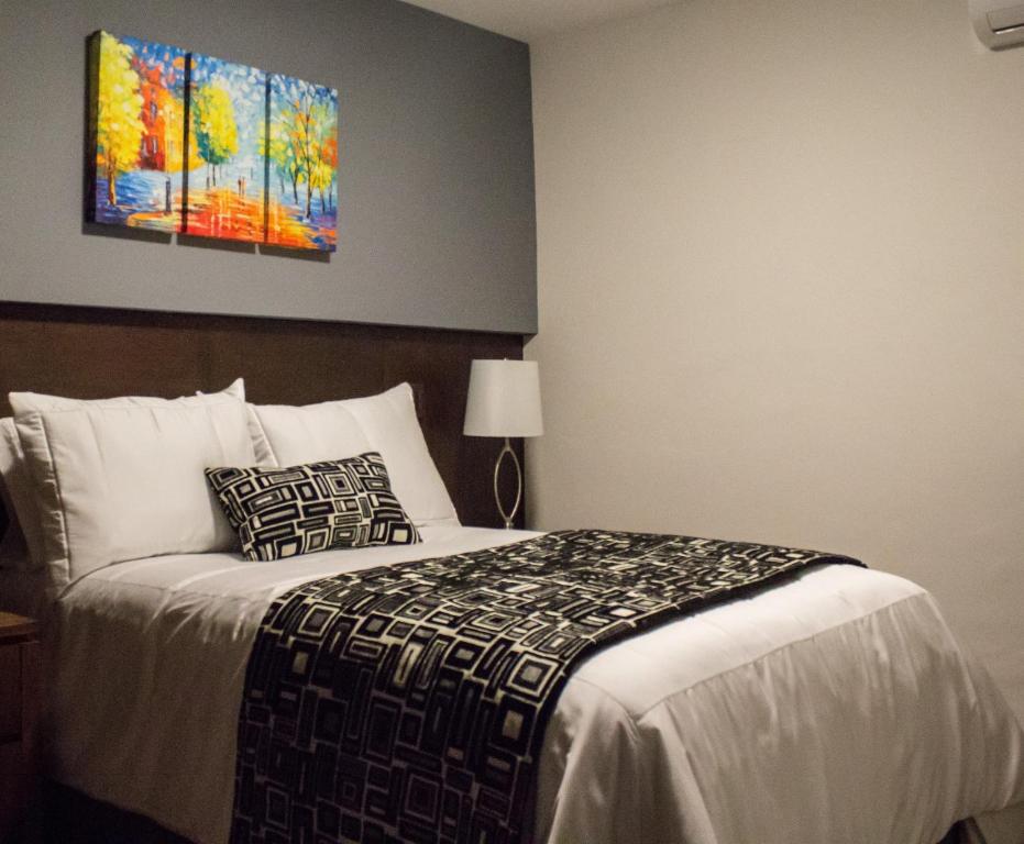 Postel nebo postele na pokoji v ubytování Hotel Corral Grande