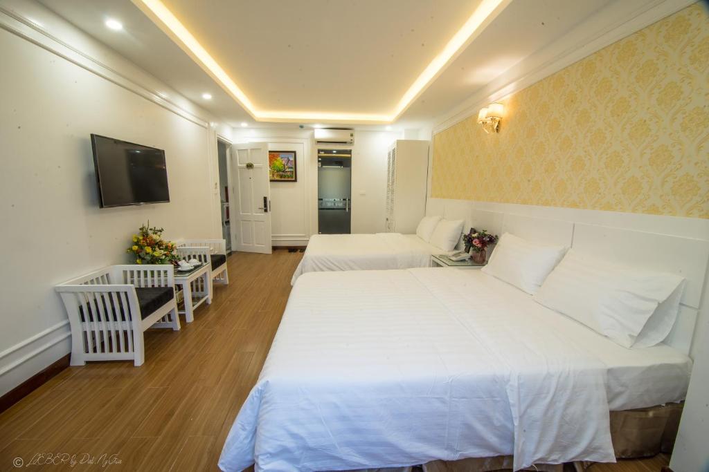 Postel nebo postele na pokoji v ubytování Lieber Hotel