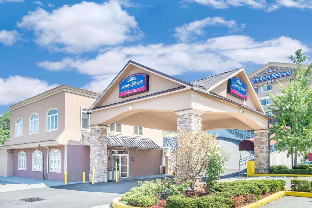 a hotel with a sign on the front of a building at Howard Johnson by Wyndham North Bergen in North Bergen