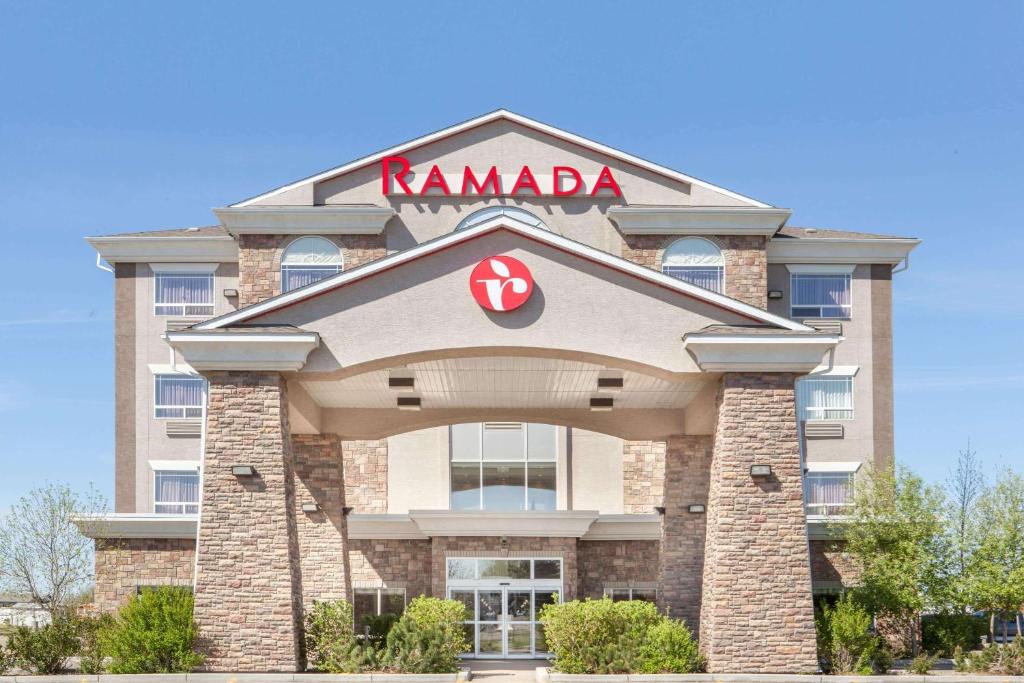 a karma building with a karma sign on it at Ramada by Wyndham Brooks in Brooks