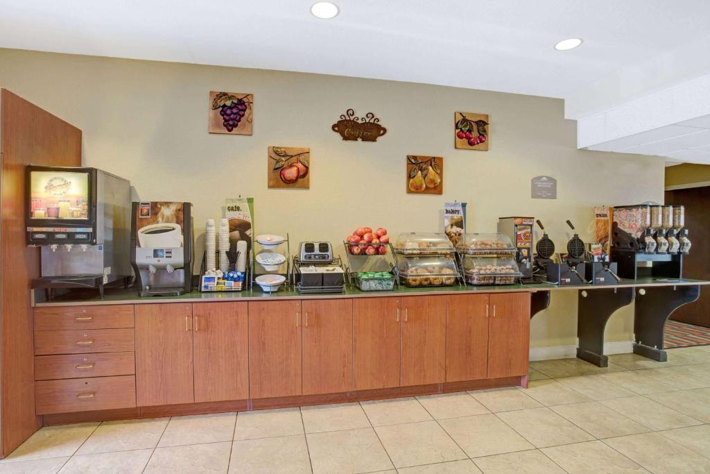 a counter in a room with food on it at Microtel Inn & Suites by Wyndham Bushnell in Bushnell