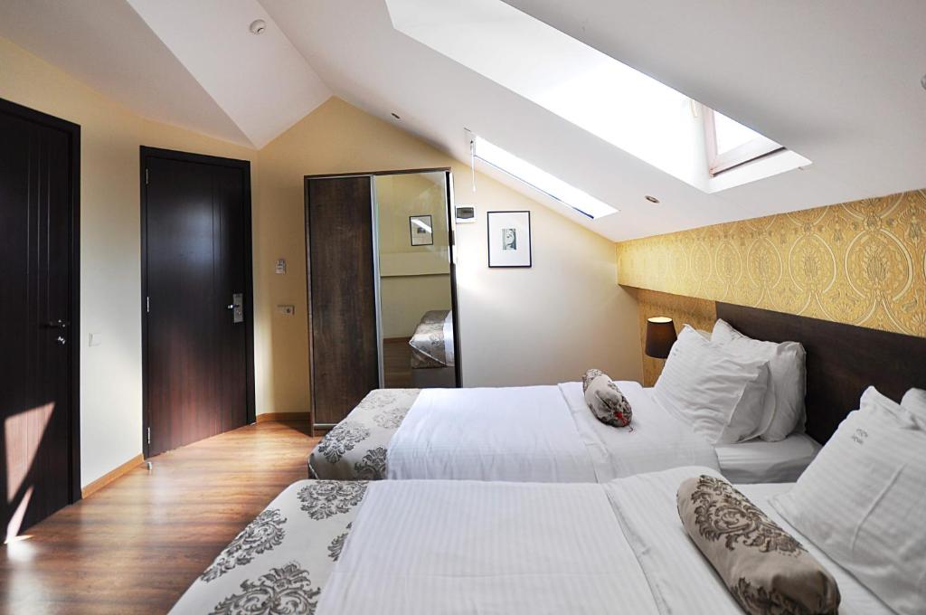 Postel nebo postele na pokoji v ubytování Tekla Palace By Urban Hotels