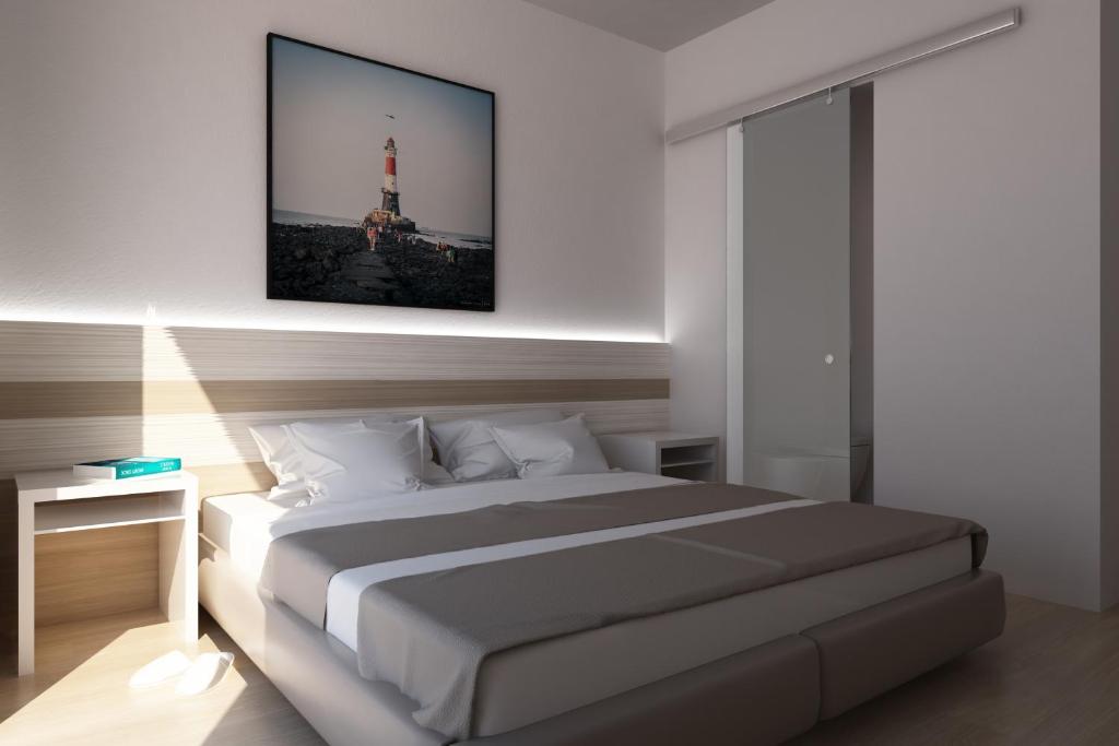 Postel nebo postele na pokoji v ubytování Hotel Portofino