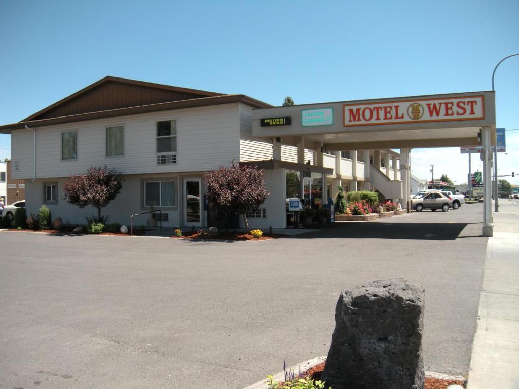 
a large building with a sign on the side of it at Motel West in Idaho Falls
