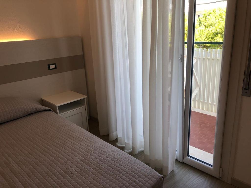Postel nebo postele na pokoji v ubytování Hotel Portofino