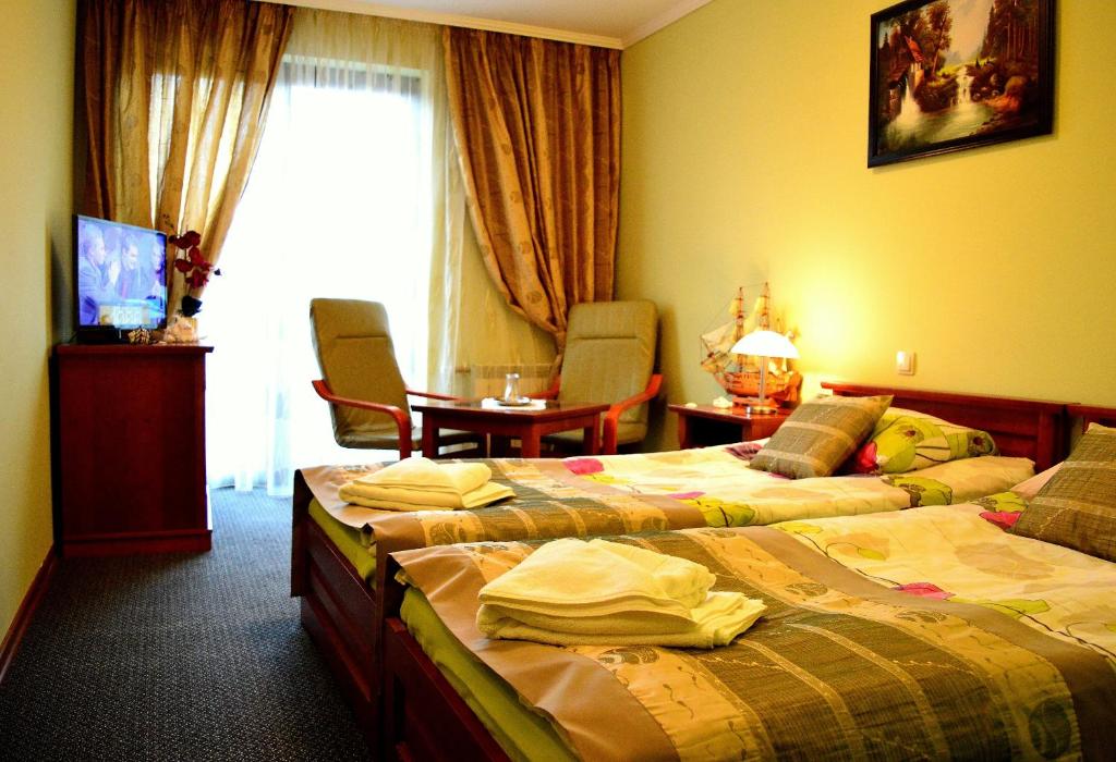 Postel nebo postele na pokoji v ubytování Hotel Spinaker