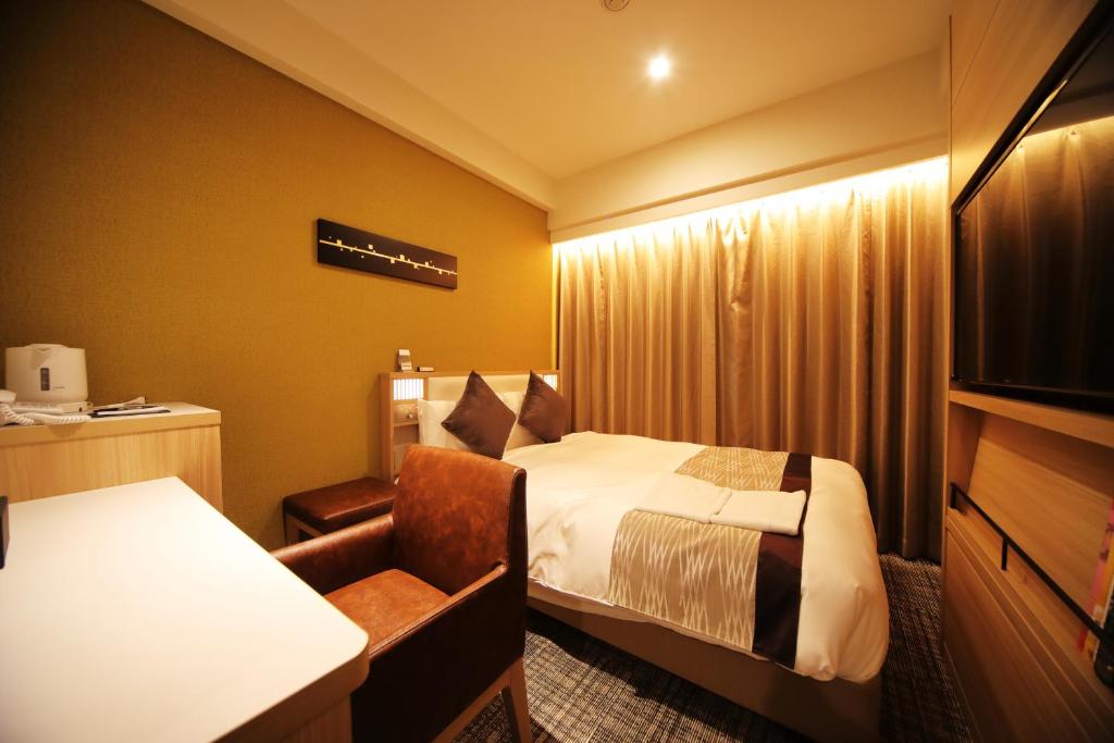 Postel nebo postele na pokoji v ubytování Hotel Sunroute Asakusa