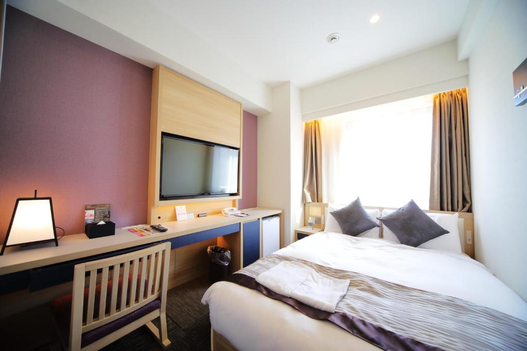 Postel nebo postele na pokoji v ubytování Hotel Sunroute Asakusa