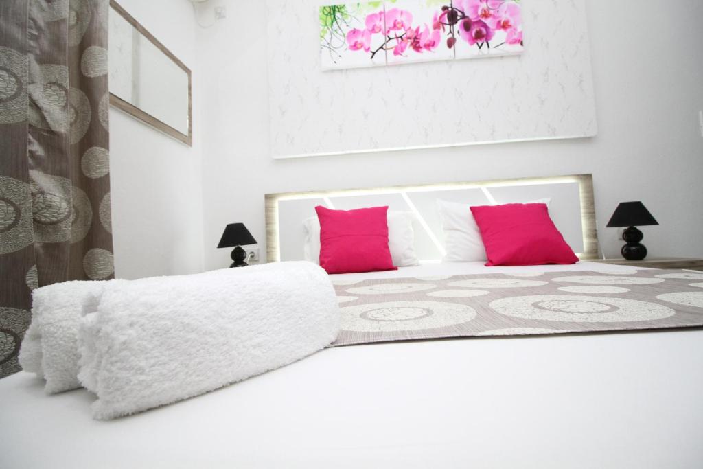 Ένα ή περισσότερα κρεβάτια σε δωμάτιο στο Apartments Cota Guesthouse
