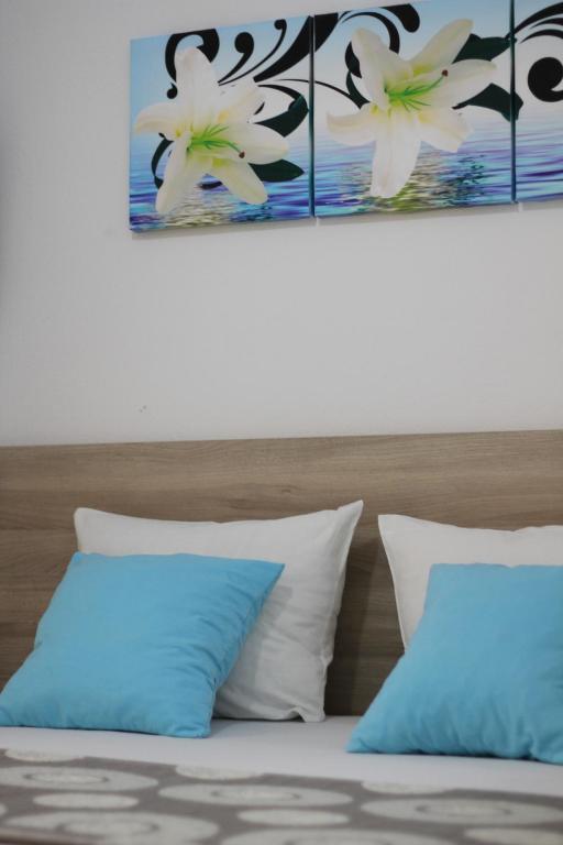 Ένα ή περισσότερα κρεβάτια σε δωμάτιο στο Apartments Cota Guesthouse