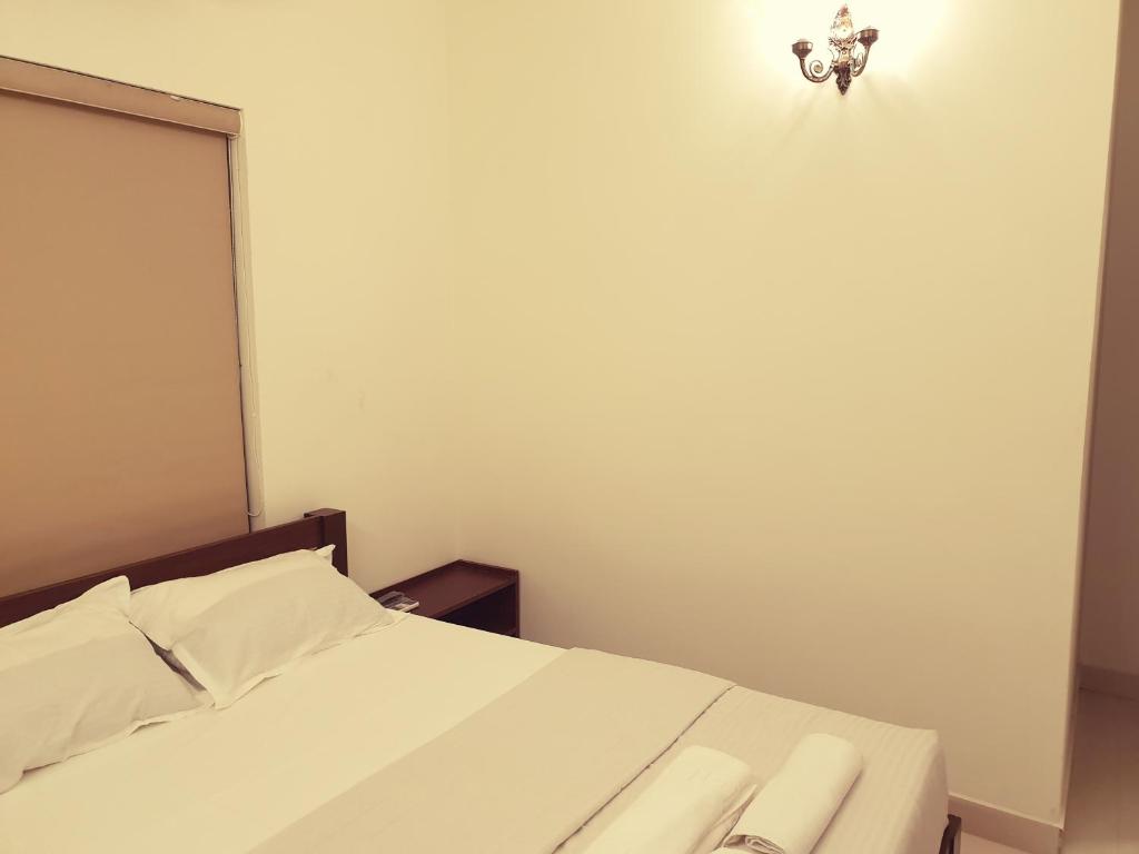 Postel nebo postele na pokoji v ubytování Chippy Inn