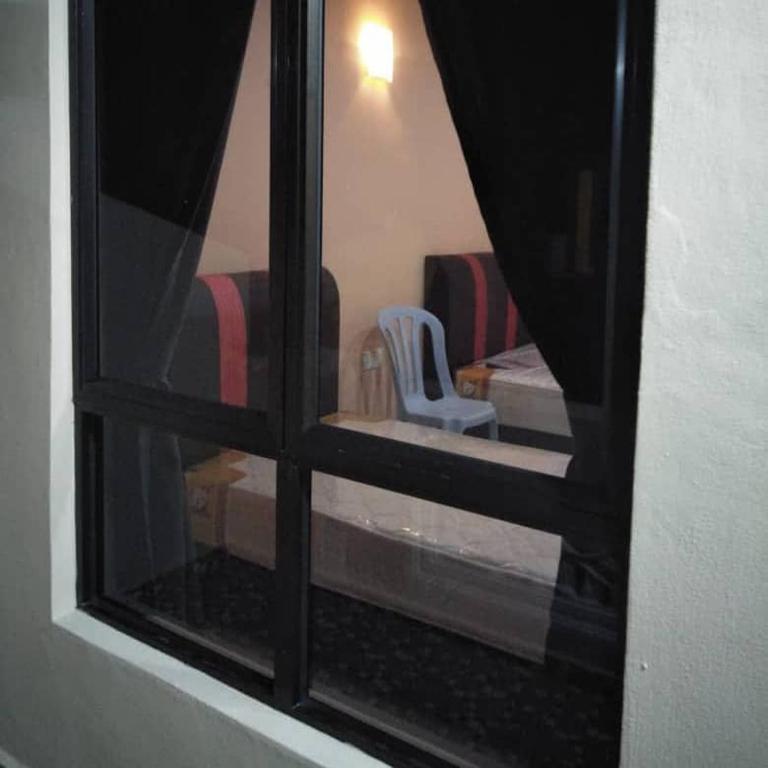 Postel nebo postele na pokoji v ubytování Mutiara Chalet
