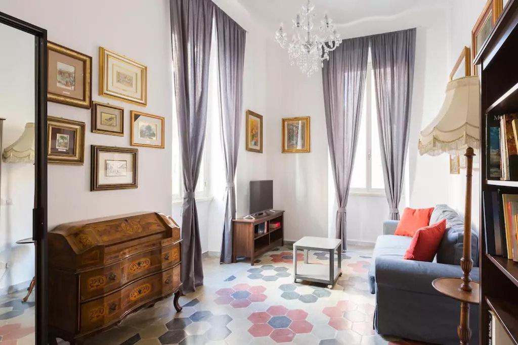 a living room with a couch and a table at Nobile Casa in Rome