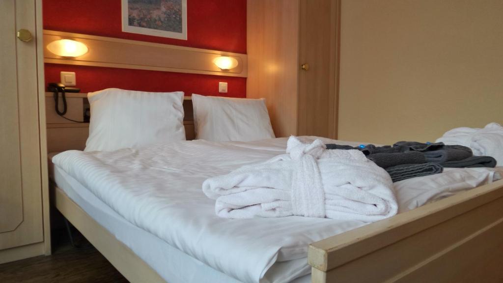 Postel nebo postele na pokoji v ubytování Hotel Europa