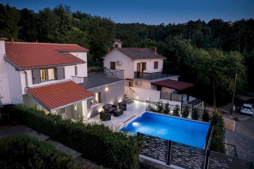 an aerial view of a house with a swimming pool at Luxury Villa FUTURE in Klimno