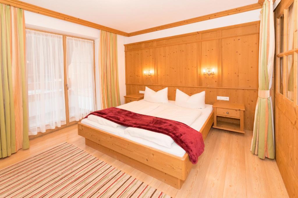 Postel nebo postele na pokoji v ubytování Das GÄSTEHAUS SCHNEIDER am Dorfplatz