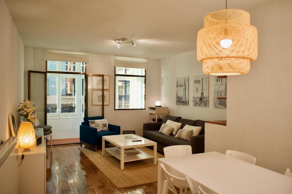 a living room with a couch and a table at Casa Andrea in Pamplona