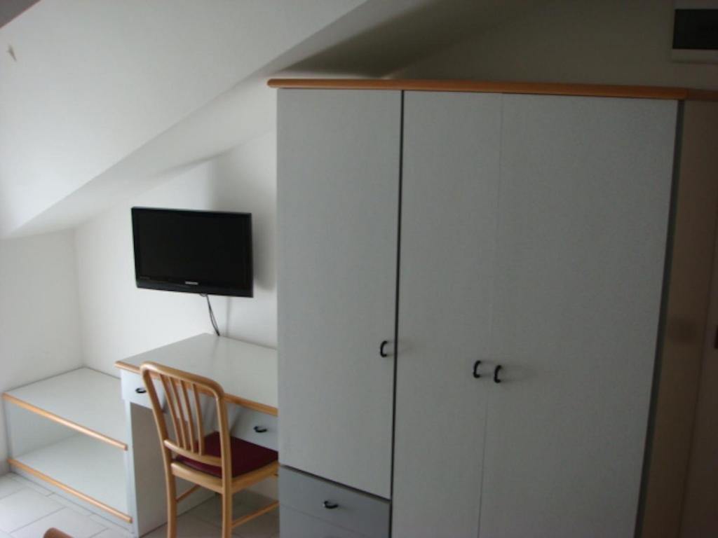 TV a/nebo společenská místnost v ubytování Hotel Adele