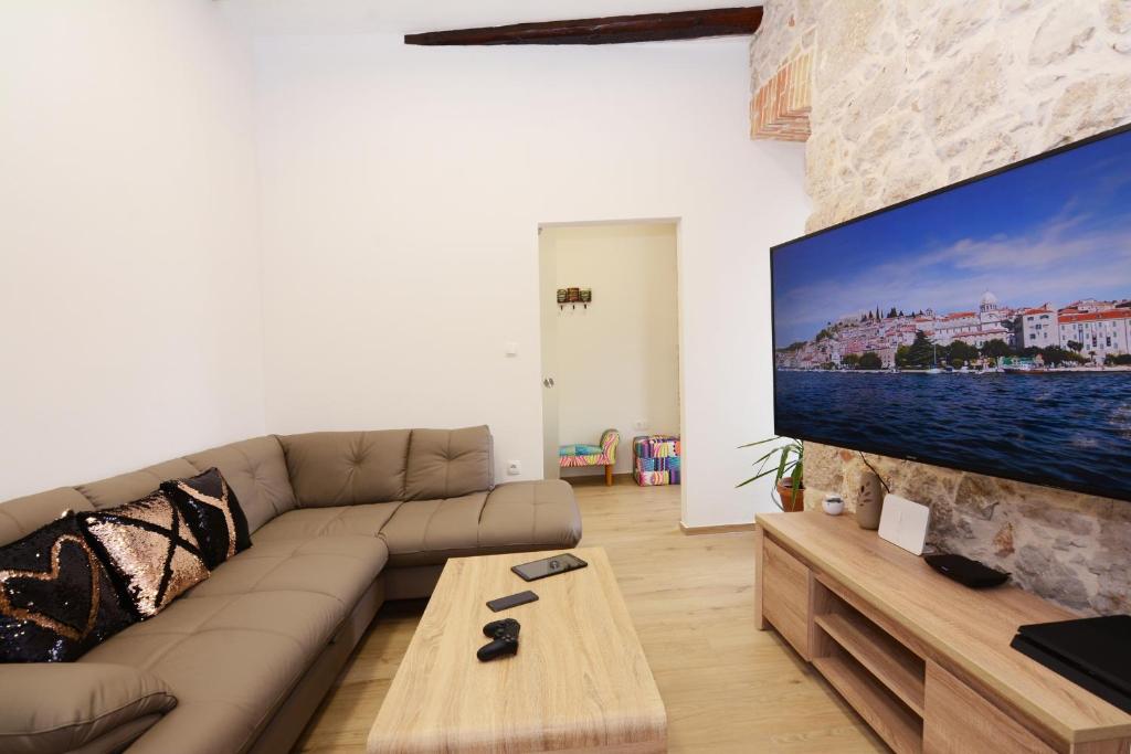Телевизор и/или развлекательный центр в XY Suites - Design Apartments