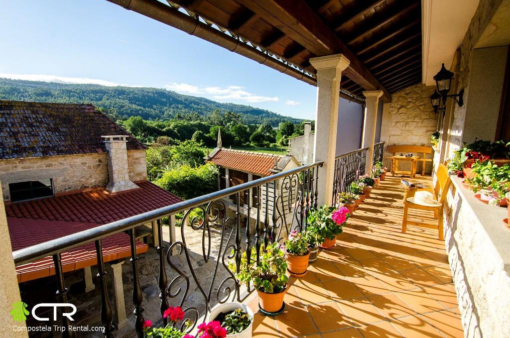a balcony with potted plants on a house at NATURAL ENVIRONMENT AND BEACHES-CTR in Valmaior
