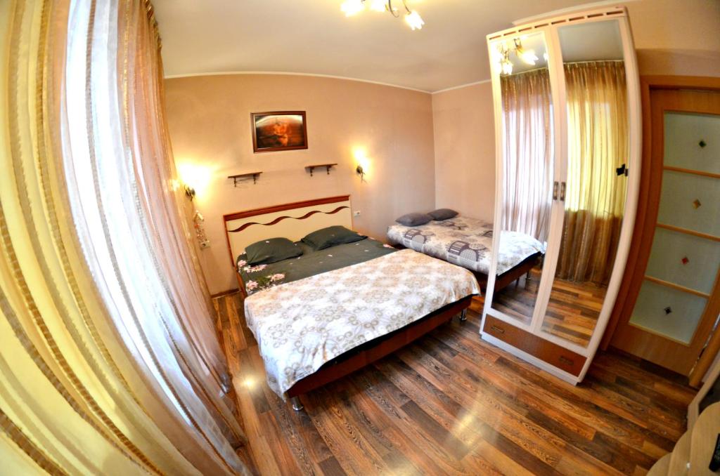 Cama ou camas em um quarto em 11А улица Свободы