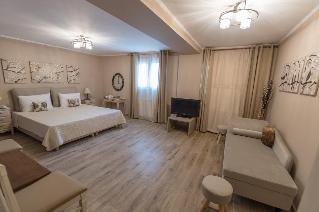 Łóżko lub łóżka w pokoju w obiekcie V. P. Place.