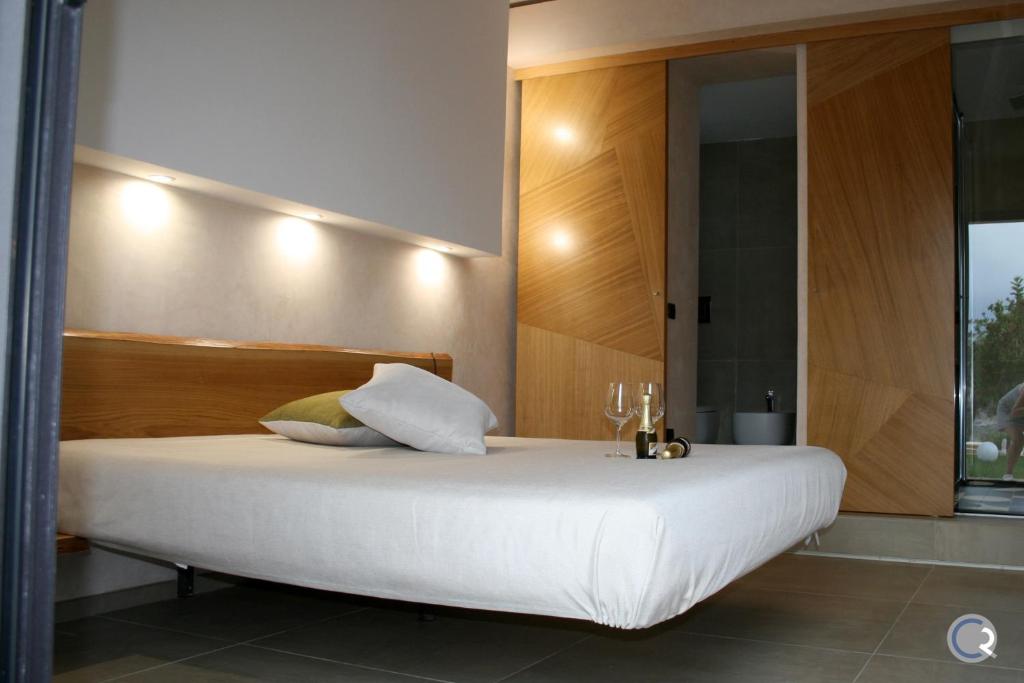 Postel nebo postele na pokoji v ubytování Punta Bianca Suite & Home Experience