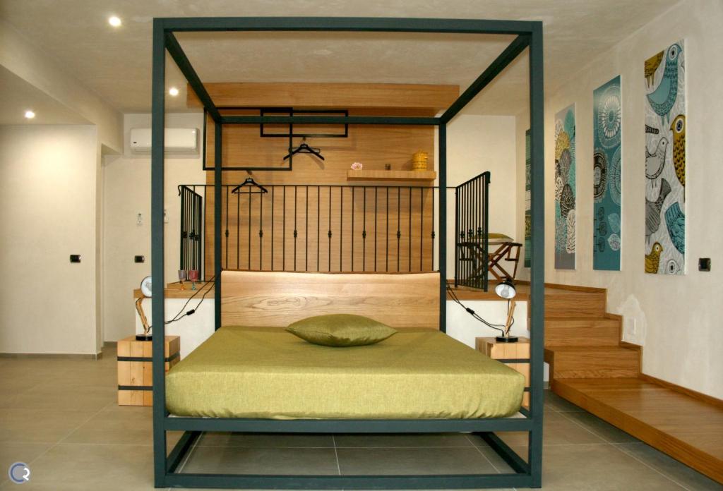 Postel nebo postele na pokoji v ubytování Punta Bianca Suite & Home Experience