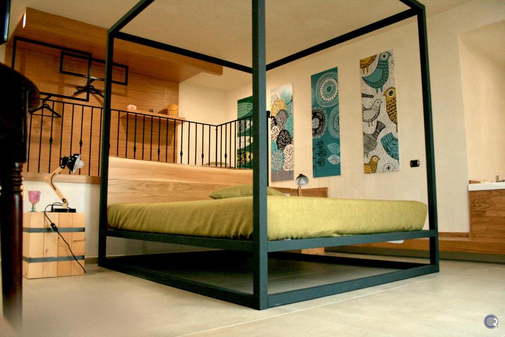 Postel nebo postele na pokoji v ubytování Punta Bianca Suite & Home Experience