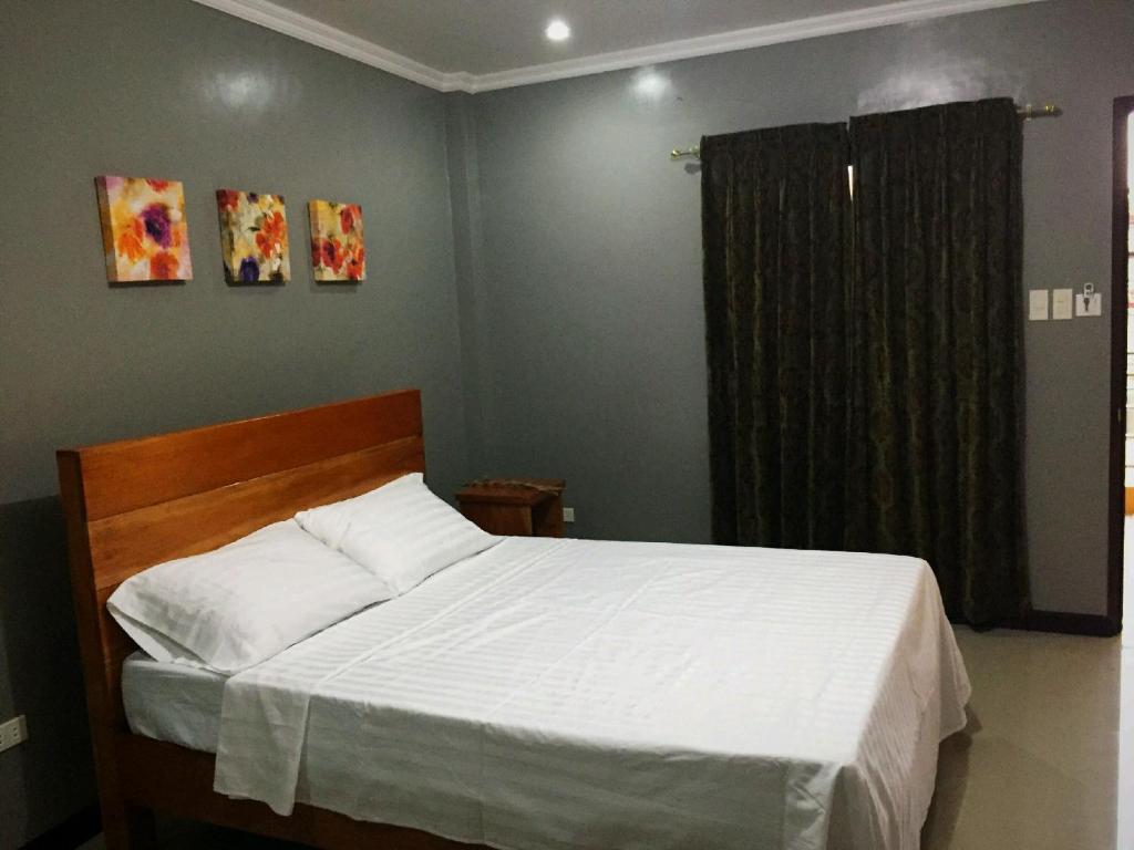 Postel nebo postele na pokoji v ubytování Golden Pension House,Palawan
