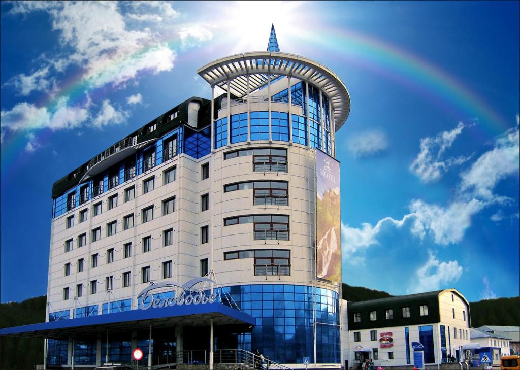 a building with a rainbow in the sky at Spa-Hotel&Resort Belovodie with Aquapark in Belokurikha