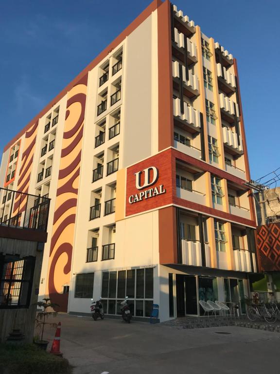 a building with a no car rental sign on it at UD Capital Hotel in Udon Thani