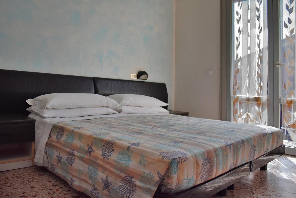 Postel nebo postele na pokoji v ubytování Hotel Manila