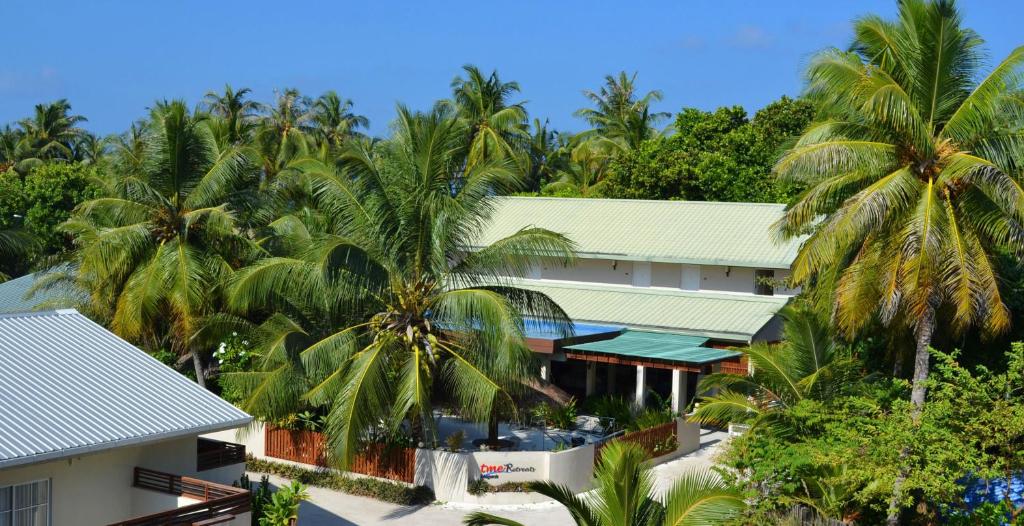 an aerial view of a resort with palm trees at TME Retreats Dhigurah in Dhigurah