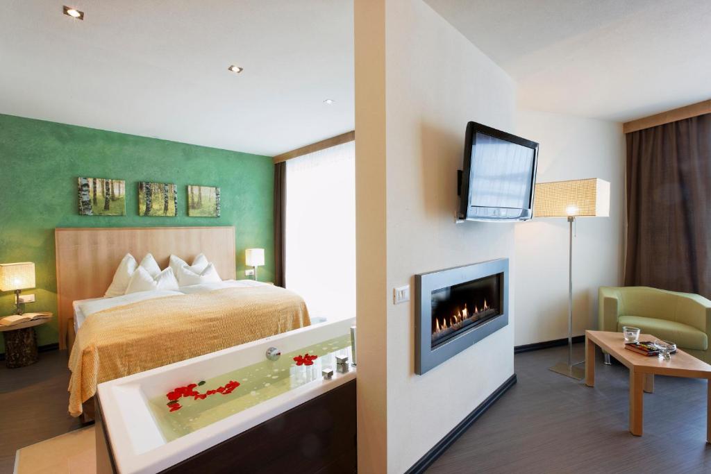 Postel nebo postele na pokoji v ubytování Hotel Amaten
