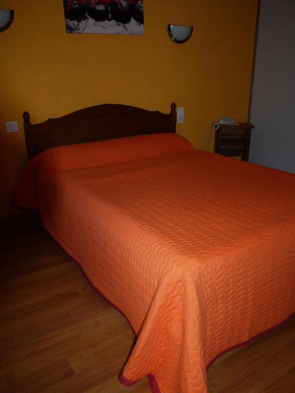 Postel nebo postele na pokoji v ubytování Hôtel Le Castelet