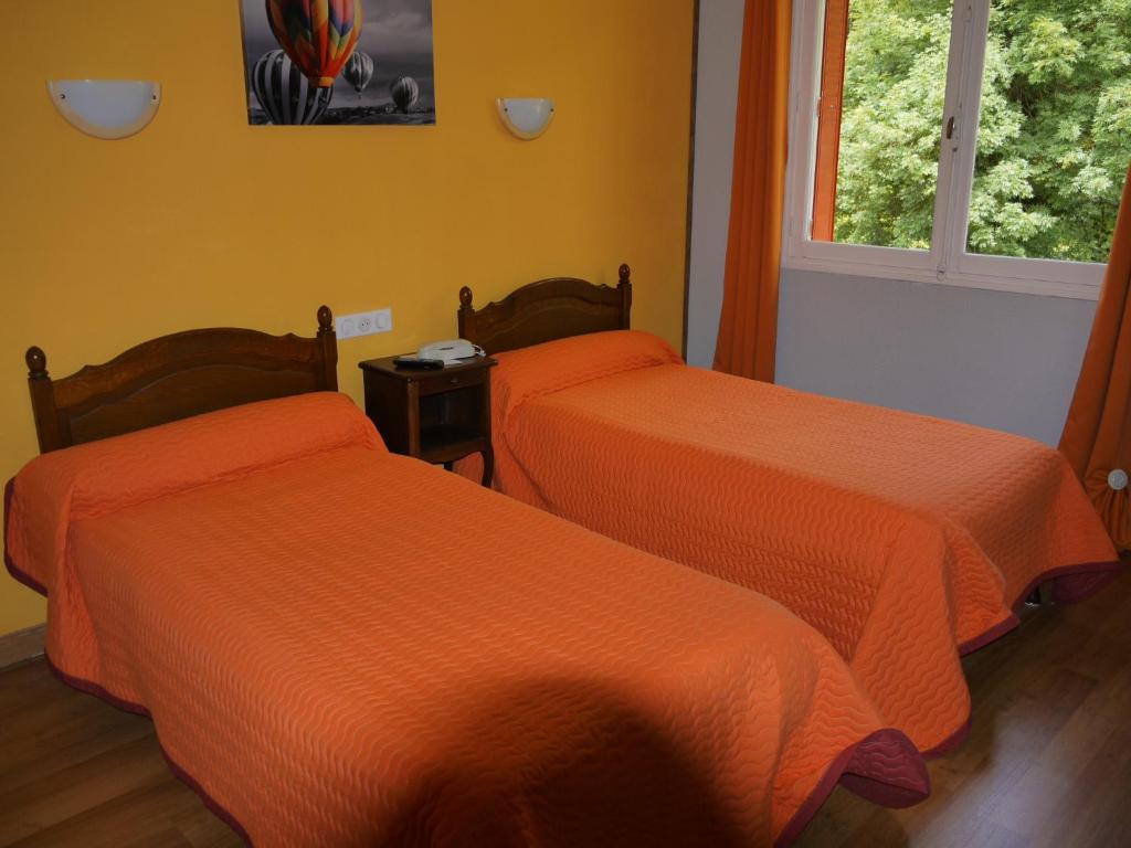 Postel nebo postele na pokoji v ubytování Hôtel Le Castelet