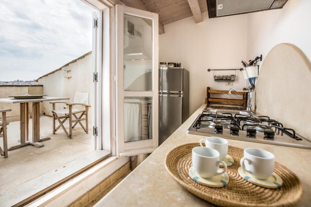 Kuchyň nebo kuchyňský kout v ubytování Musciara Siracusa Resort