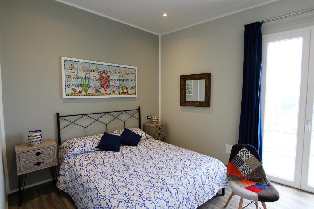 A bed or beds in a room at Case Vacanza Le Casette