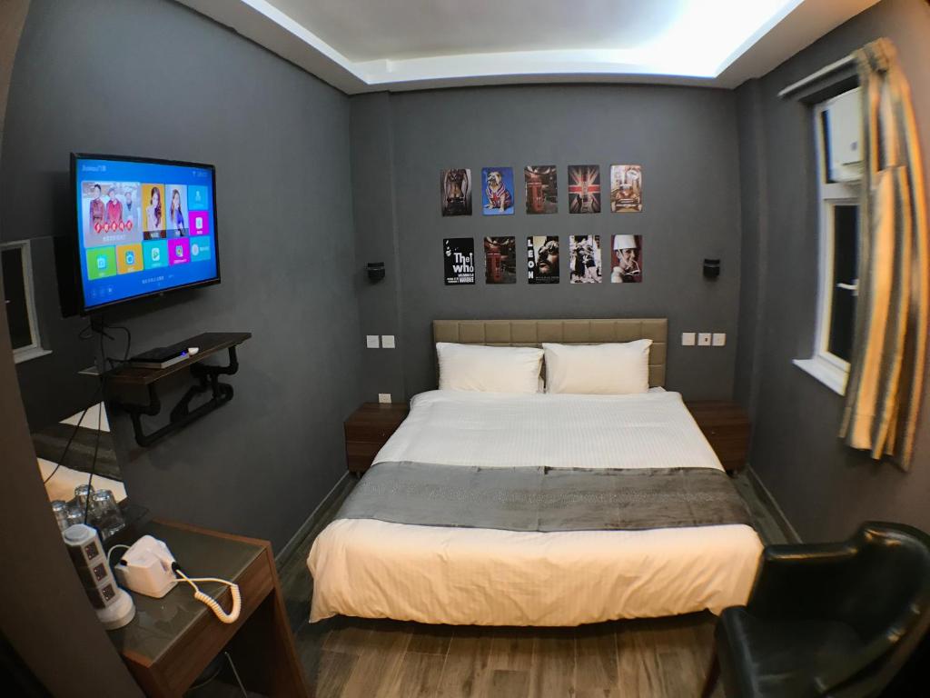 Ένα ή περισσότερα κρεβάτια σε δωμάτιο στο Soso Hostel