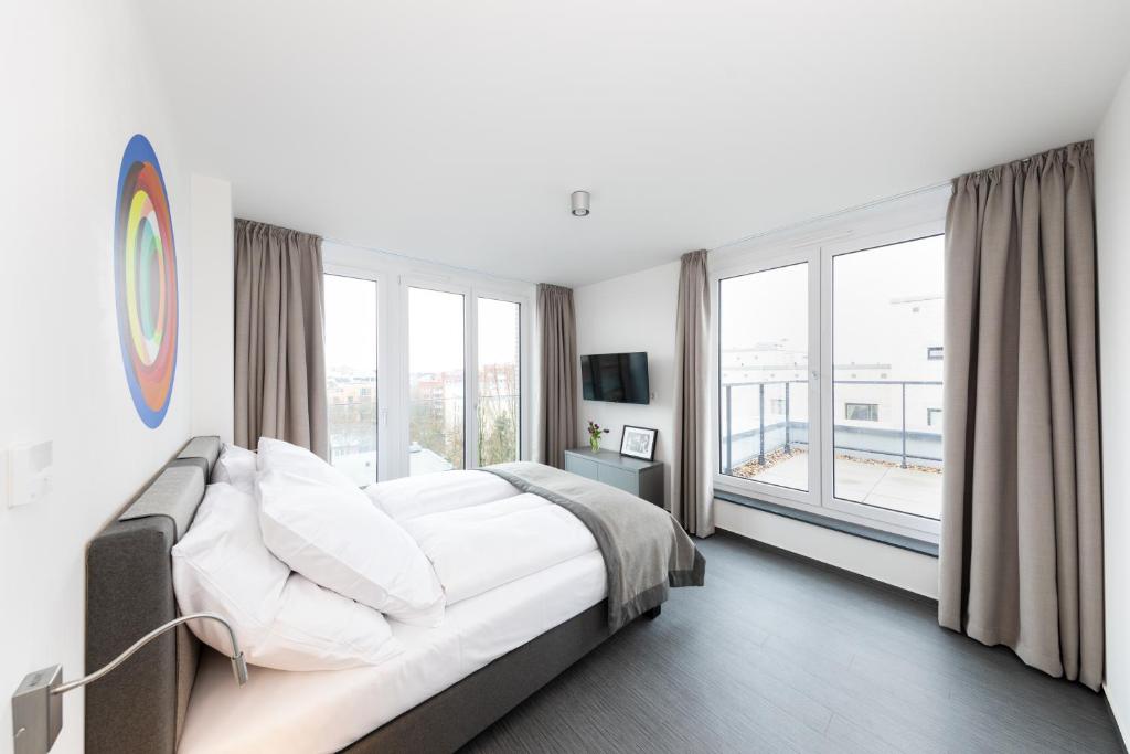 Postel nebo postele na pokoji v ubytování Boardinghouse St.Pauli