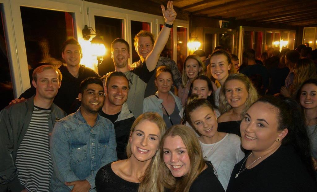 a group of people posing for a picture at Schutzenbach Backpackers For Adults 18-35 in Lauterbrunnen