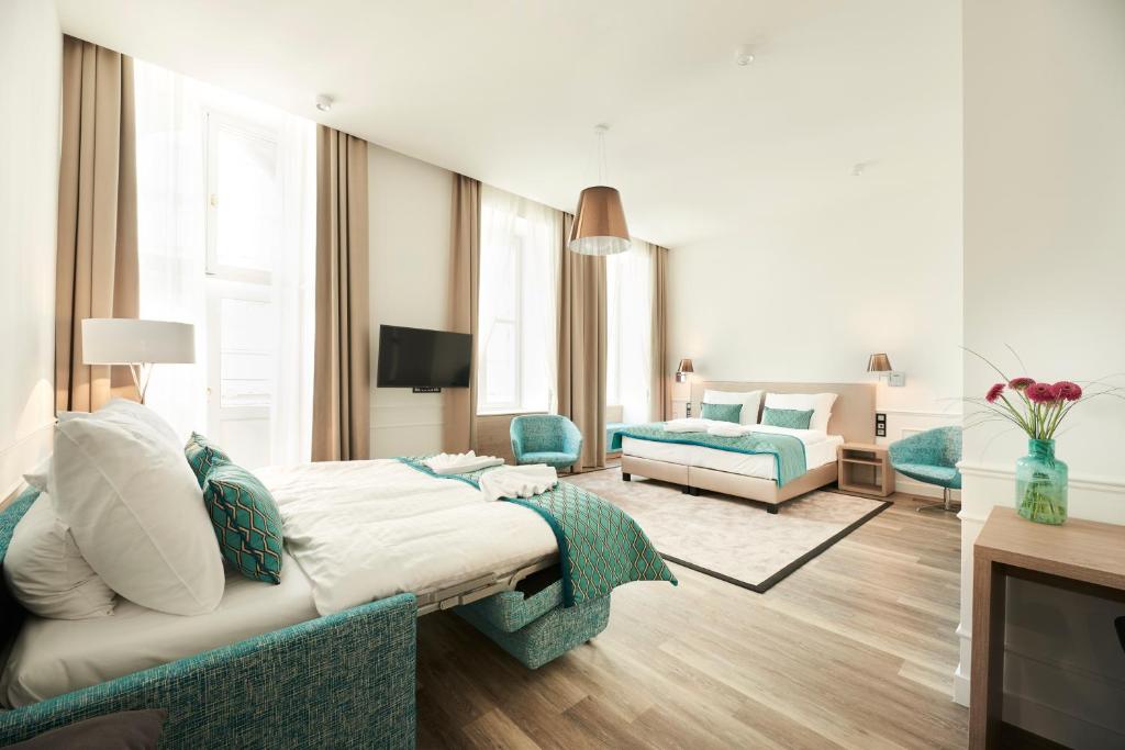 Posteľ alebo postele v izbe v ubytovaní Boutique Residence Budapest