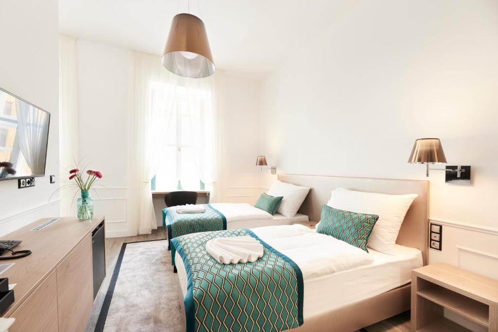 Posteľ alebo postele v izbe v ubytovaní Boutique Residence Budapest