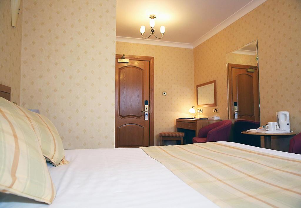 Postel nebo postele na pokoji v ubytování Leapark Hotel
