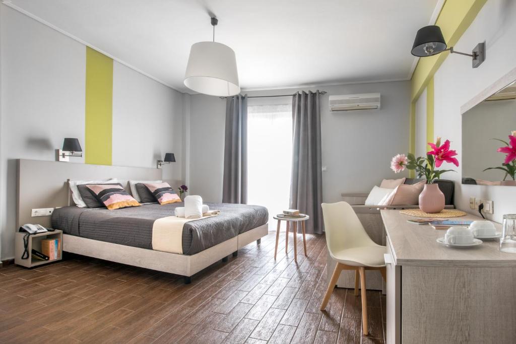 Postel nebo postele na pokoji v ubytování Myrto Hotel
