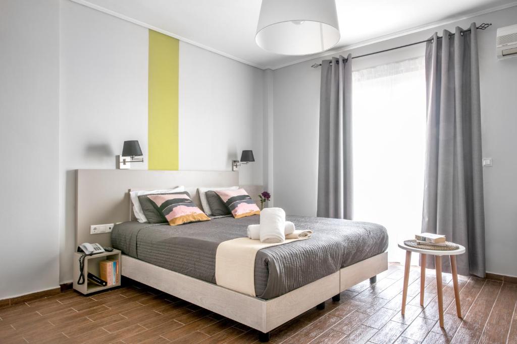 Postel nebo postele na pokoji v ubytování Myrto Hotel